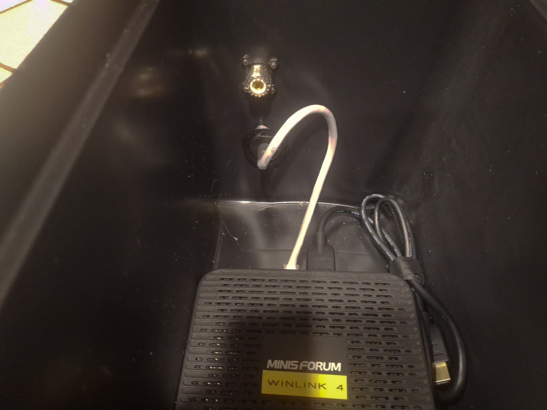 Micro PC installed in the bottom of the utility box with short network cable attached to open port and enough room for USB and power cables to be run cleanly.